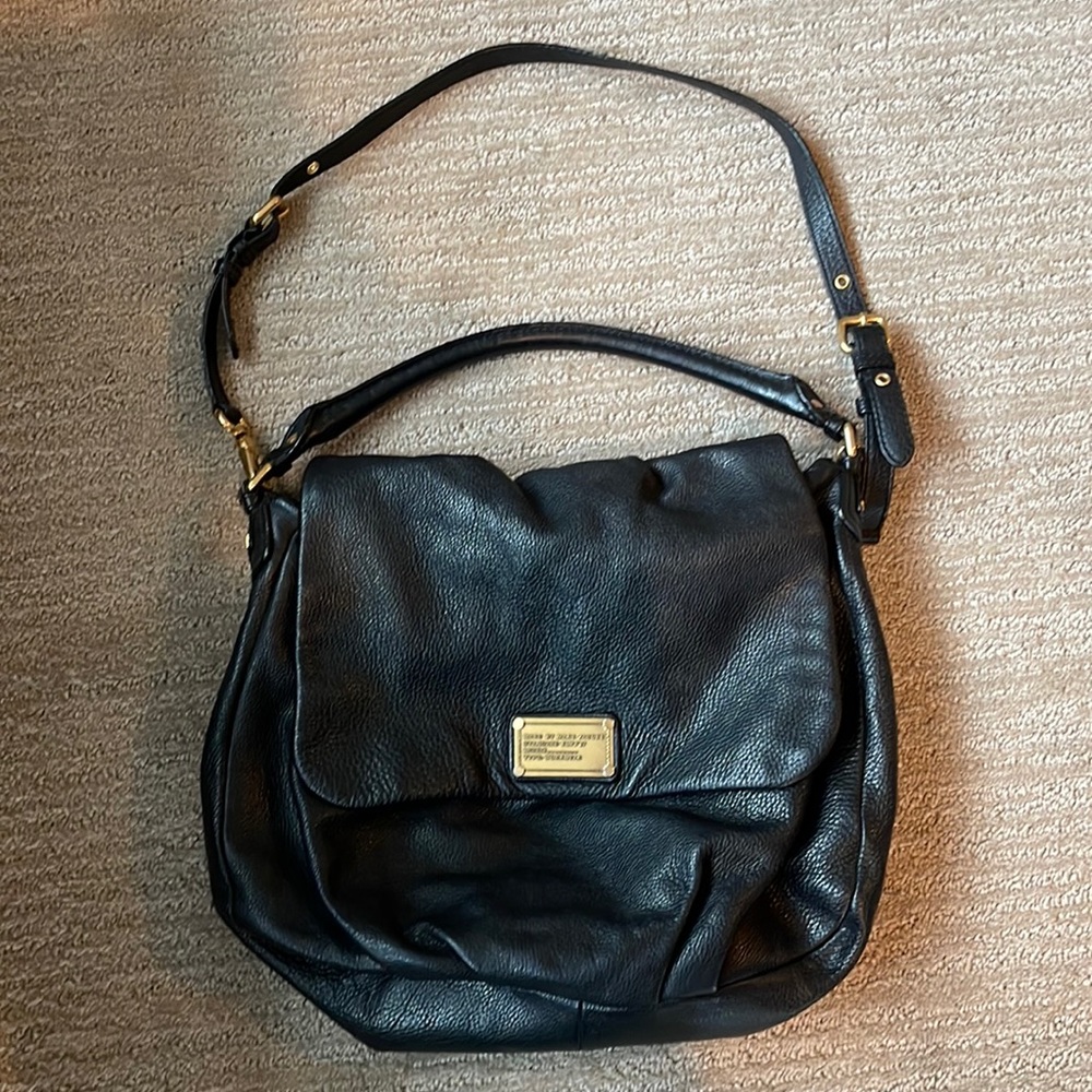 Large Marc Jacobs black leather bag. Shoulder and cross body strap.